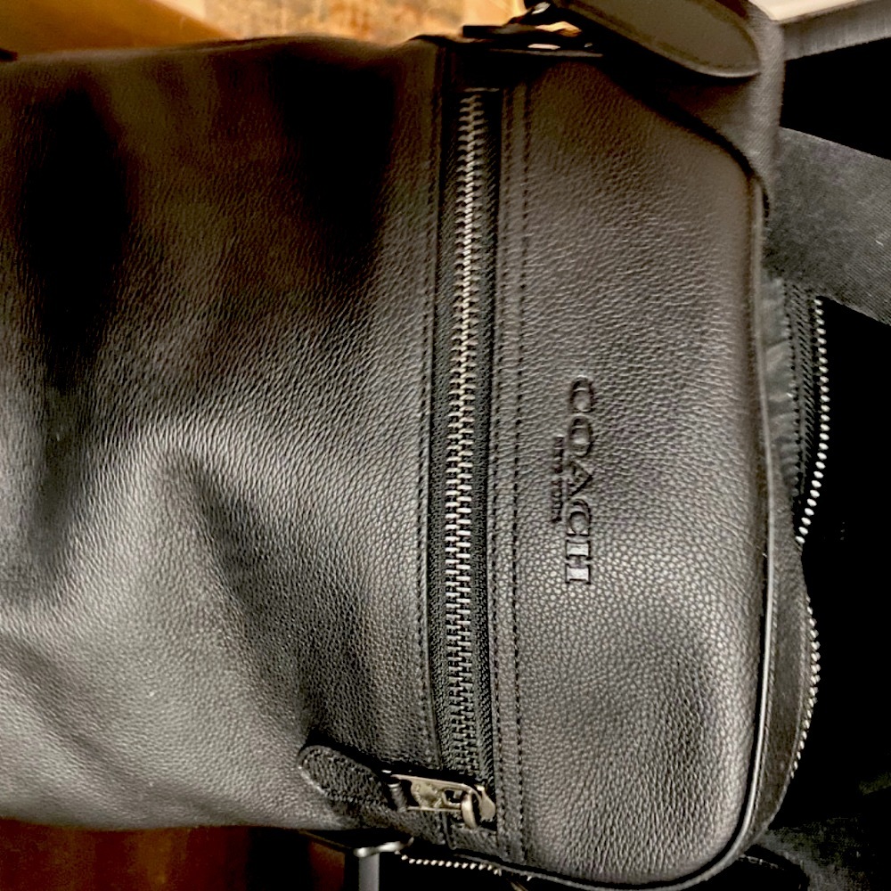 COACH Cross Body, gender neutral leather bag. Black, no monogram (yet).